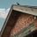 Rustic wooden roof of The Tavern with painted signage