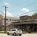 Street view of a local business area with public art mural