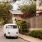 View of the local neighborhood showing a van and some landscaping