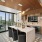Chic dining area with open shelves and large TV