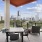 Balcony with table and chairs overlooking downtown
