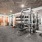 Gym with weightlifting equipment and mirrored wall