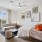 Studio apartment with bed, sofa, and large window